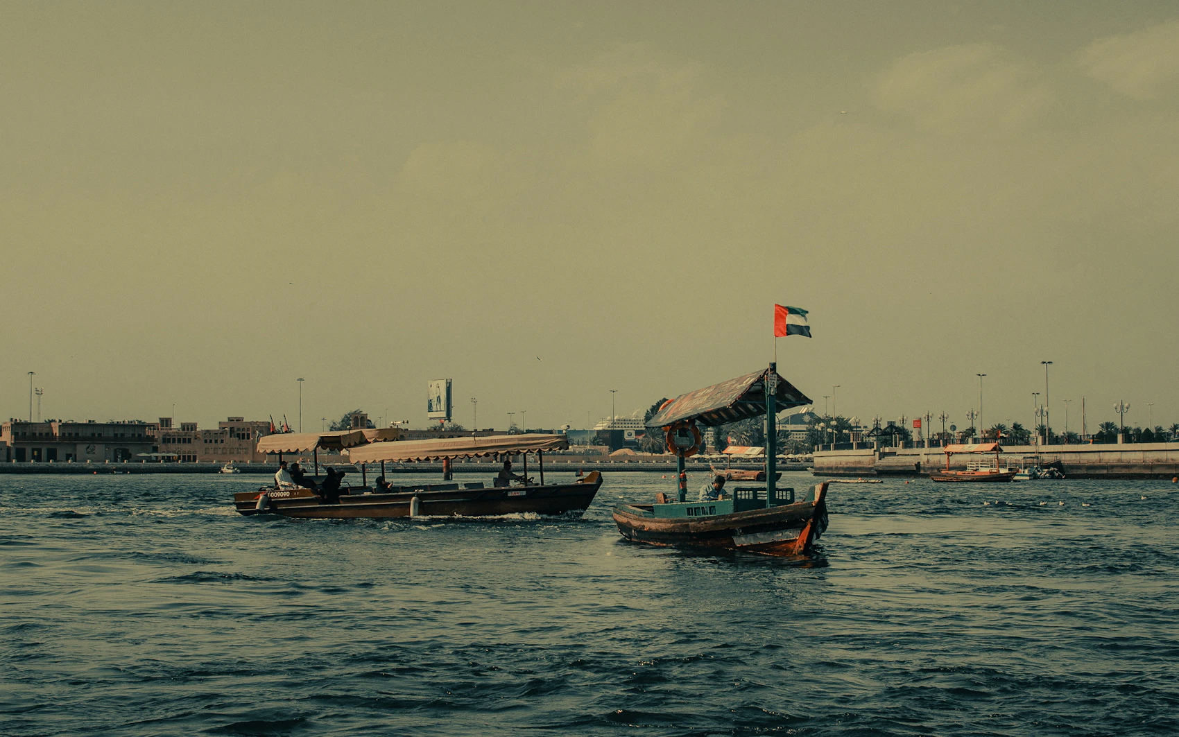 Traditional abra boats crossing Dubai Creek