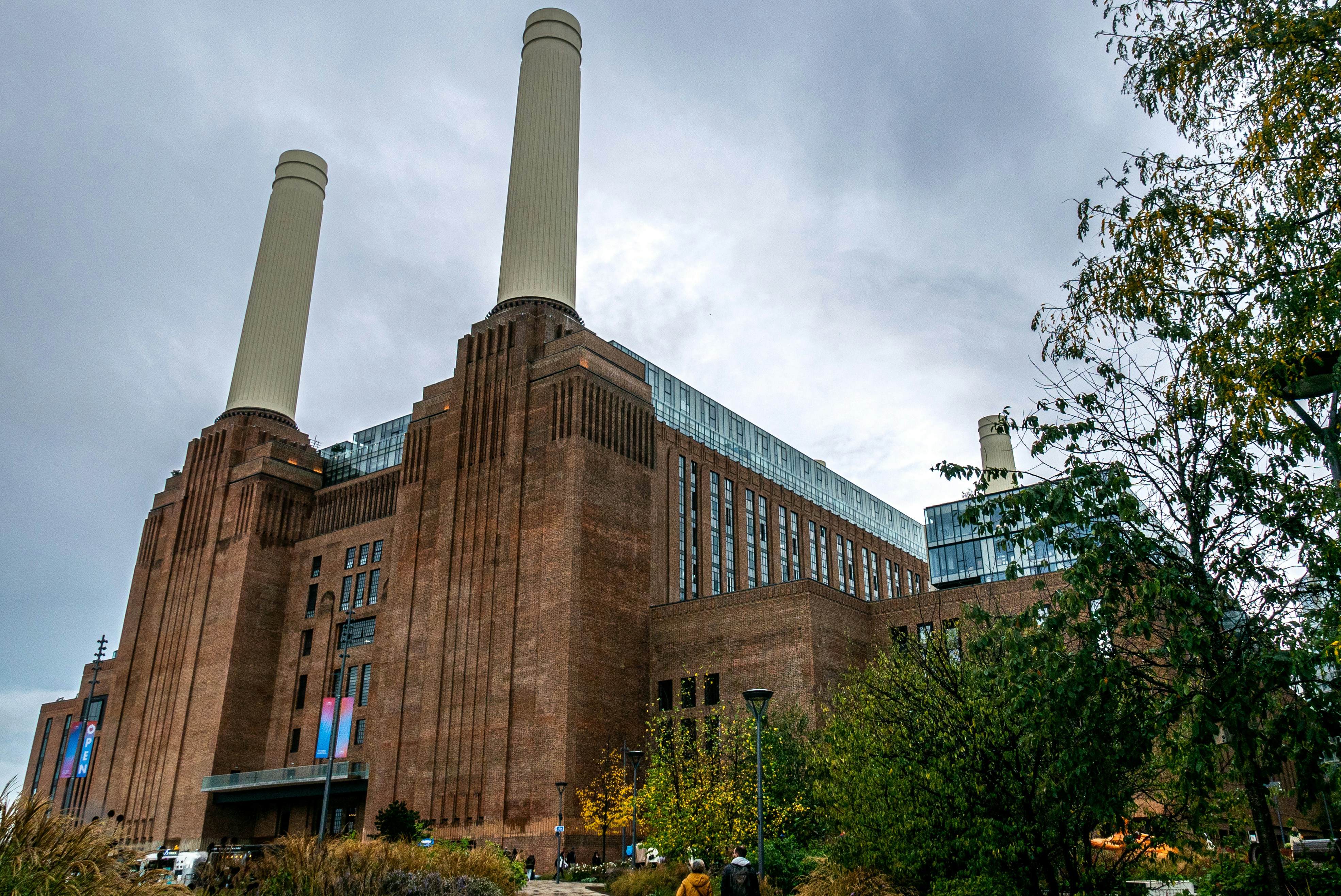 a large building with smokestacks