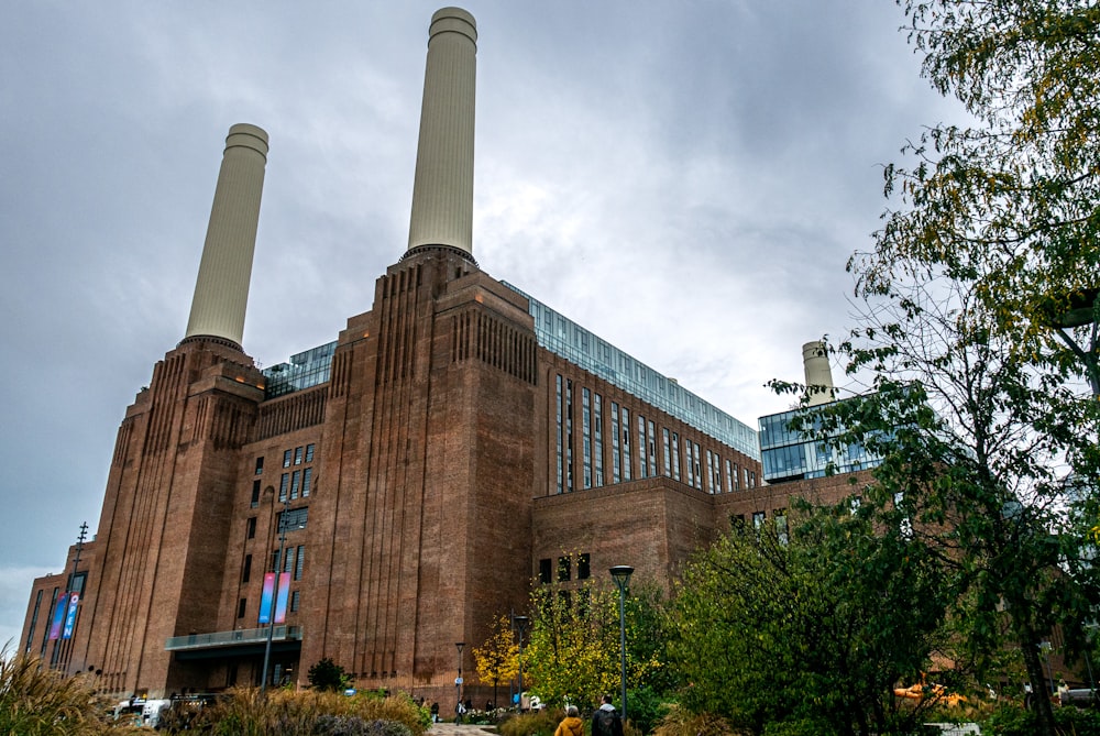 a large building with smokestacks