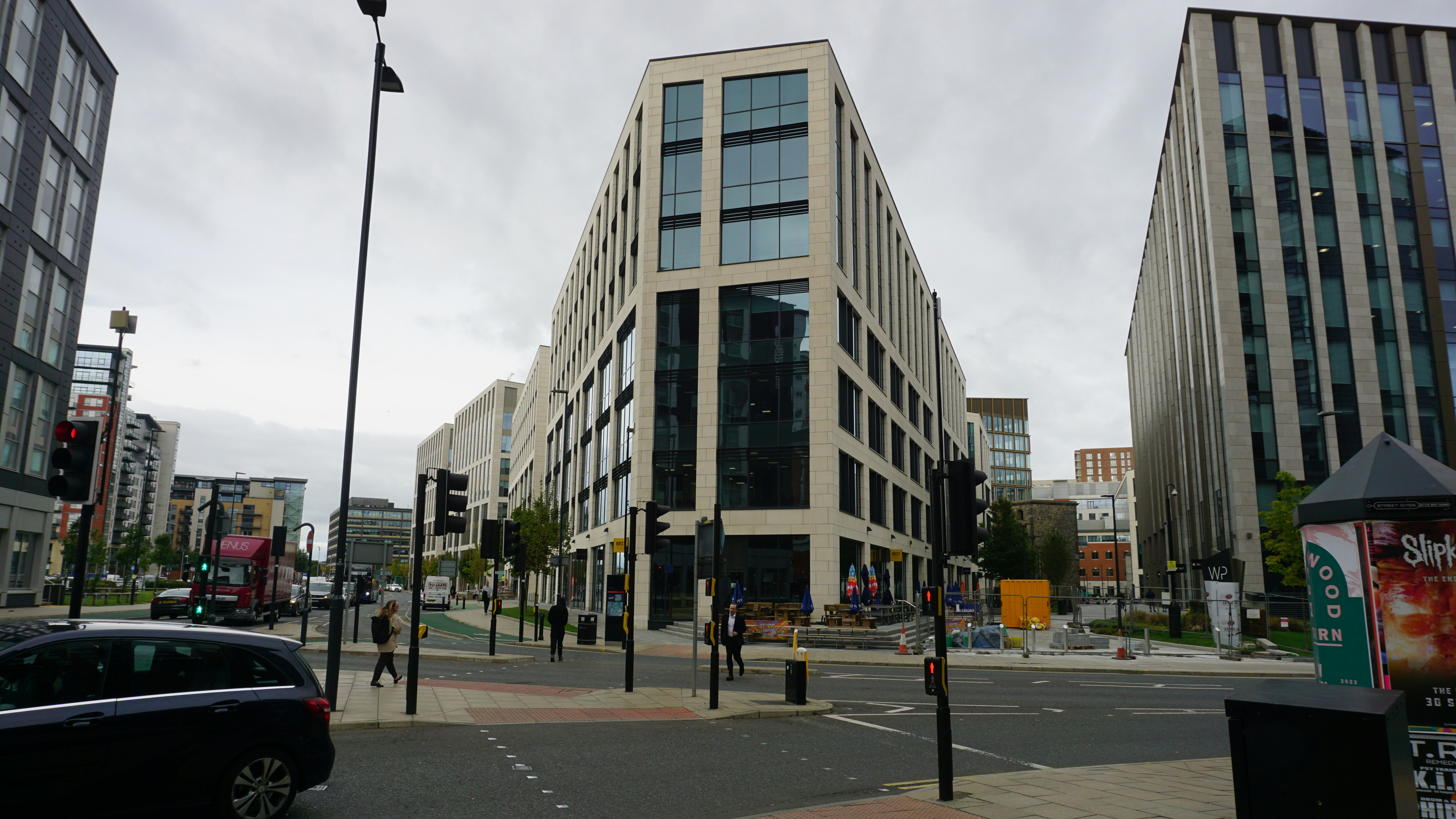 a street with cars and buildings on either side of it