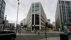 a street with cars and buildings on either side of it