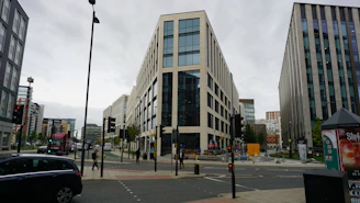 a street with cars and buildings on either side of it