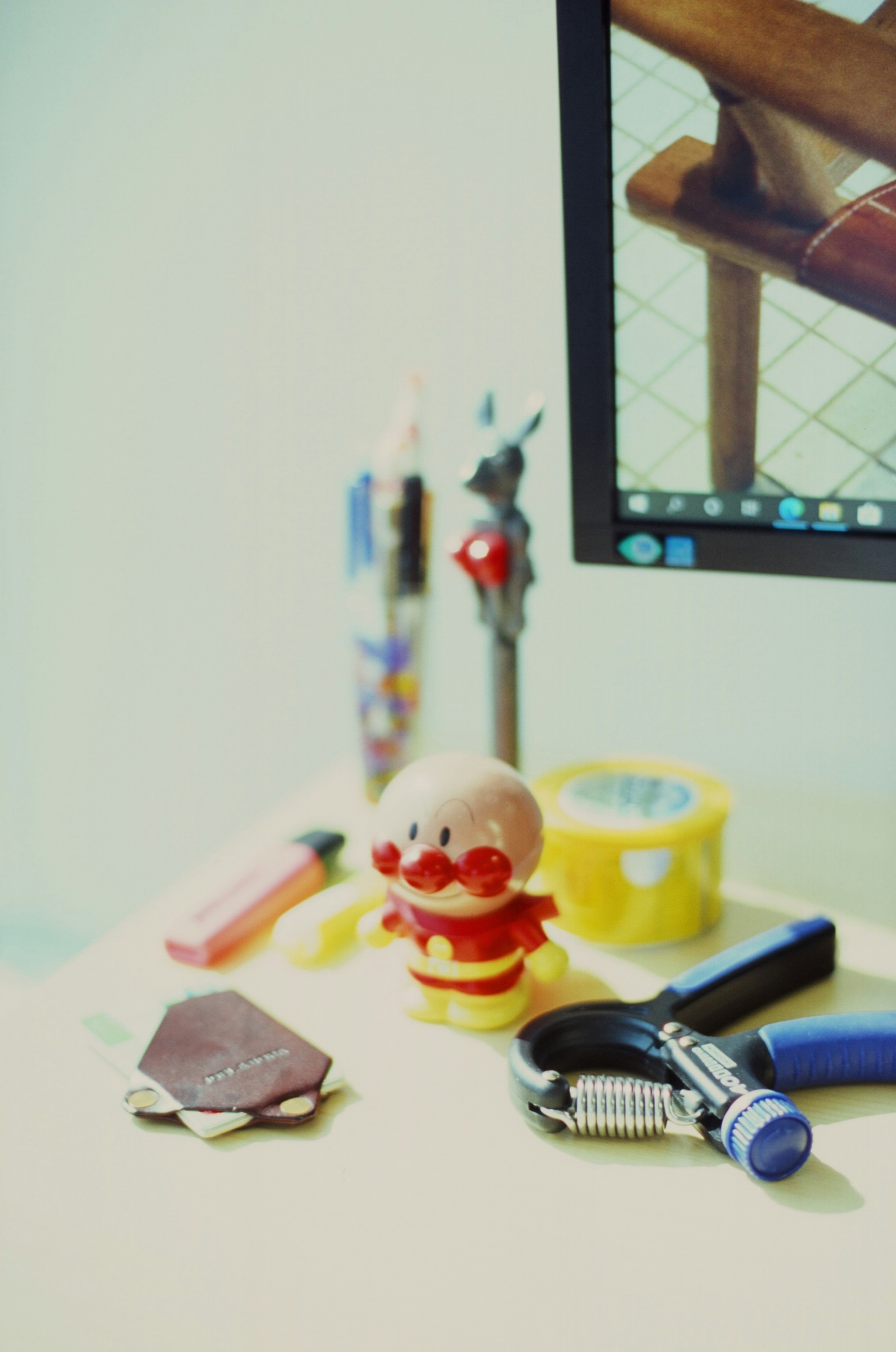 a toy doll next to a toothbrush and a toothbrush