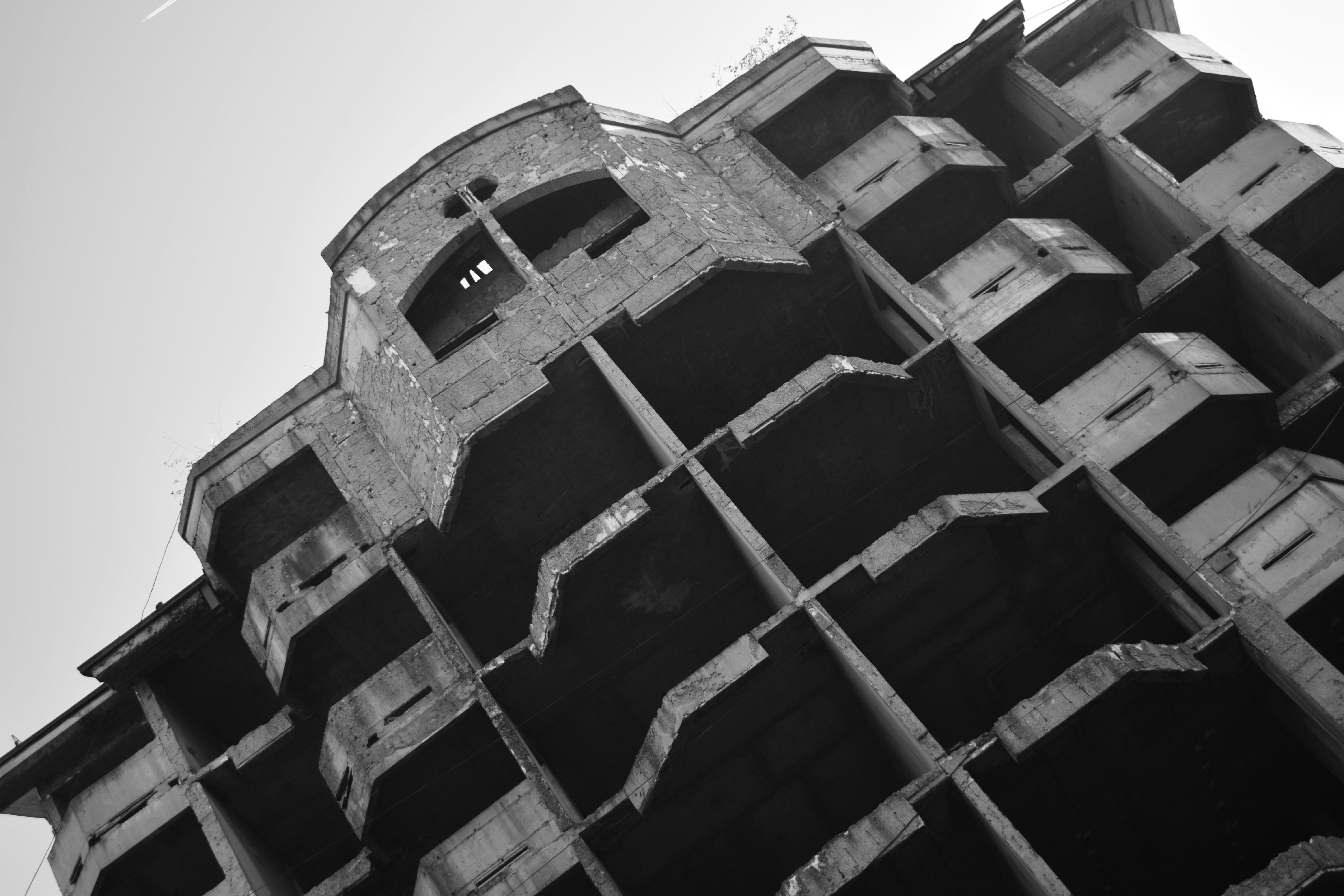 a tall building with a curved top