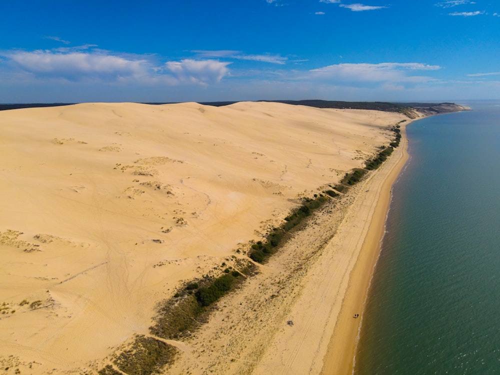 a sandy beach with water