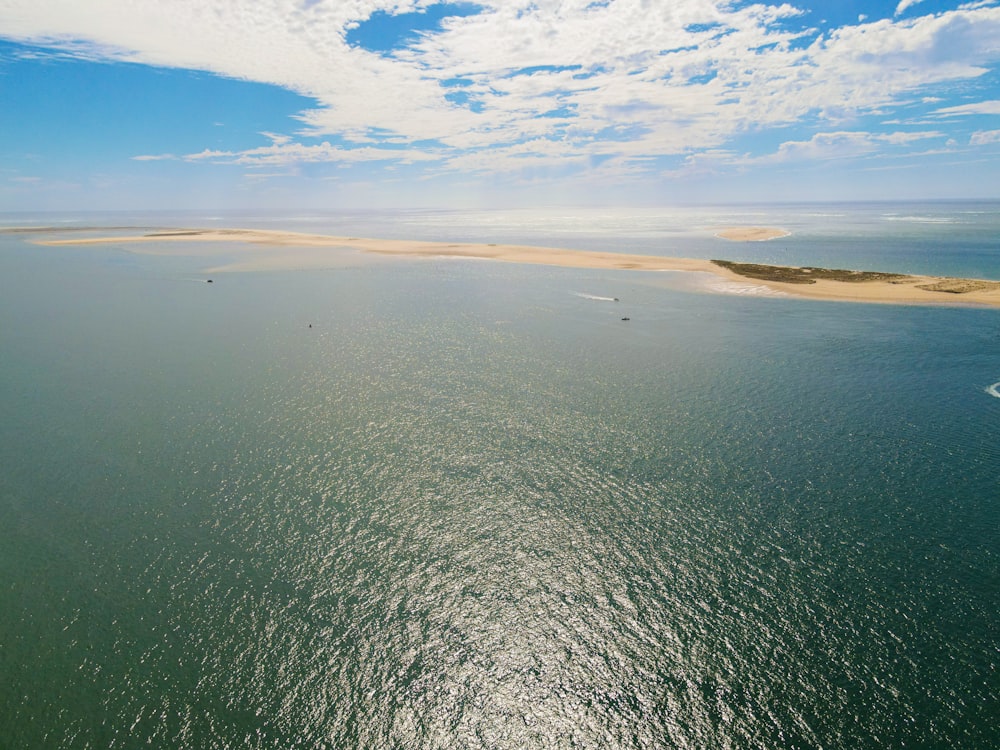 a body of water with land in the background