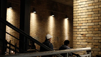 a man and a woman sitting on a staircase