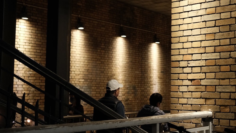 a man and a woman sitting on a staircase