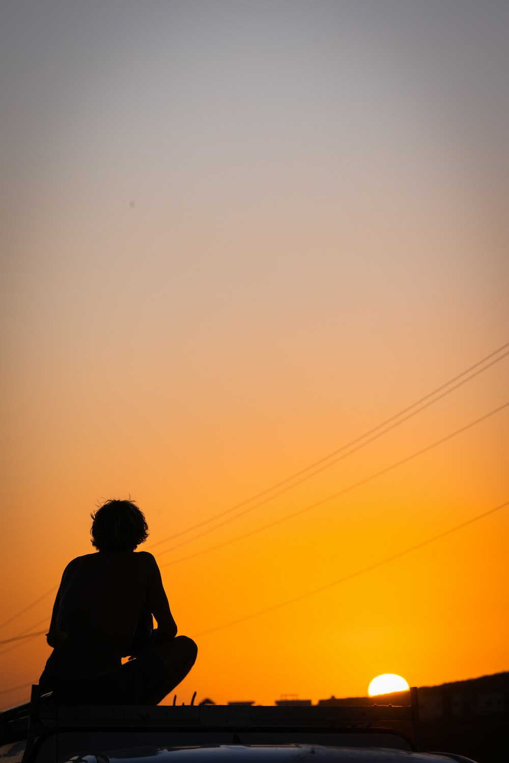 a person sitting on a roof