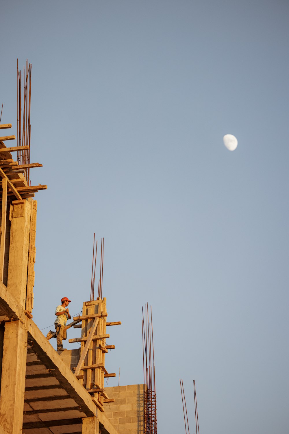 a person on a ladder on a roof