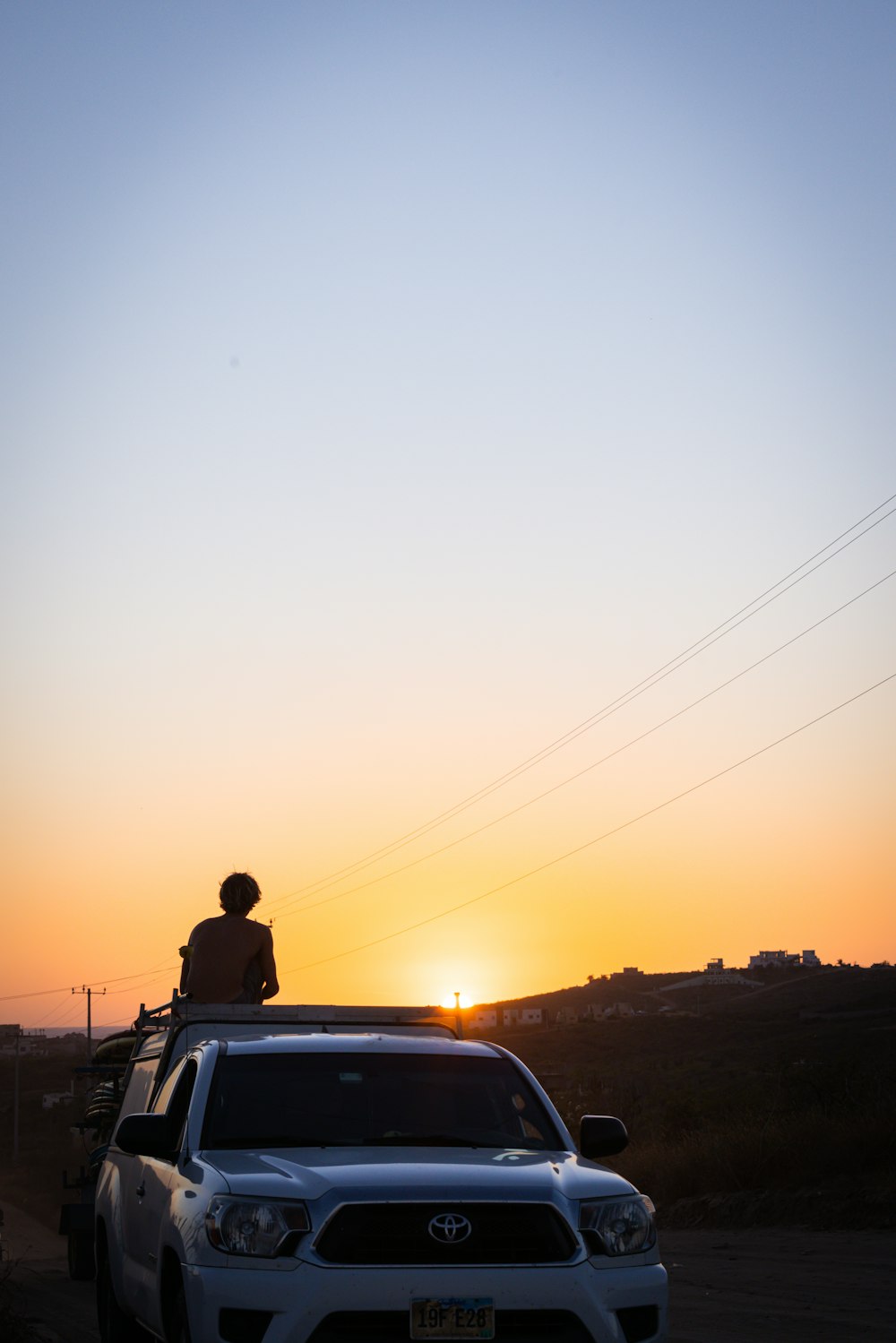 a man sitting on a car