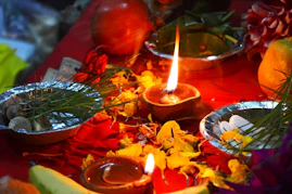 a candle in a bowl of food