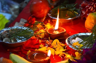 a candle in a bowl of food