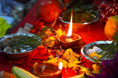 a candle in a bowl of food