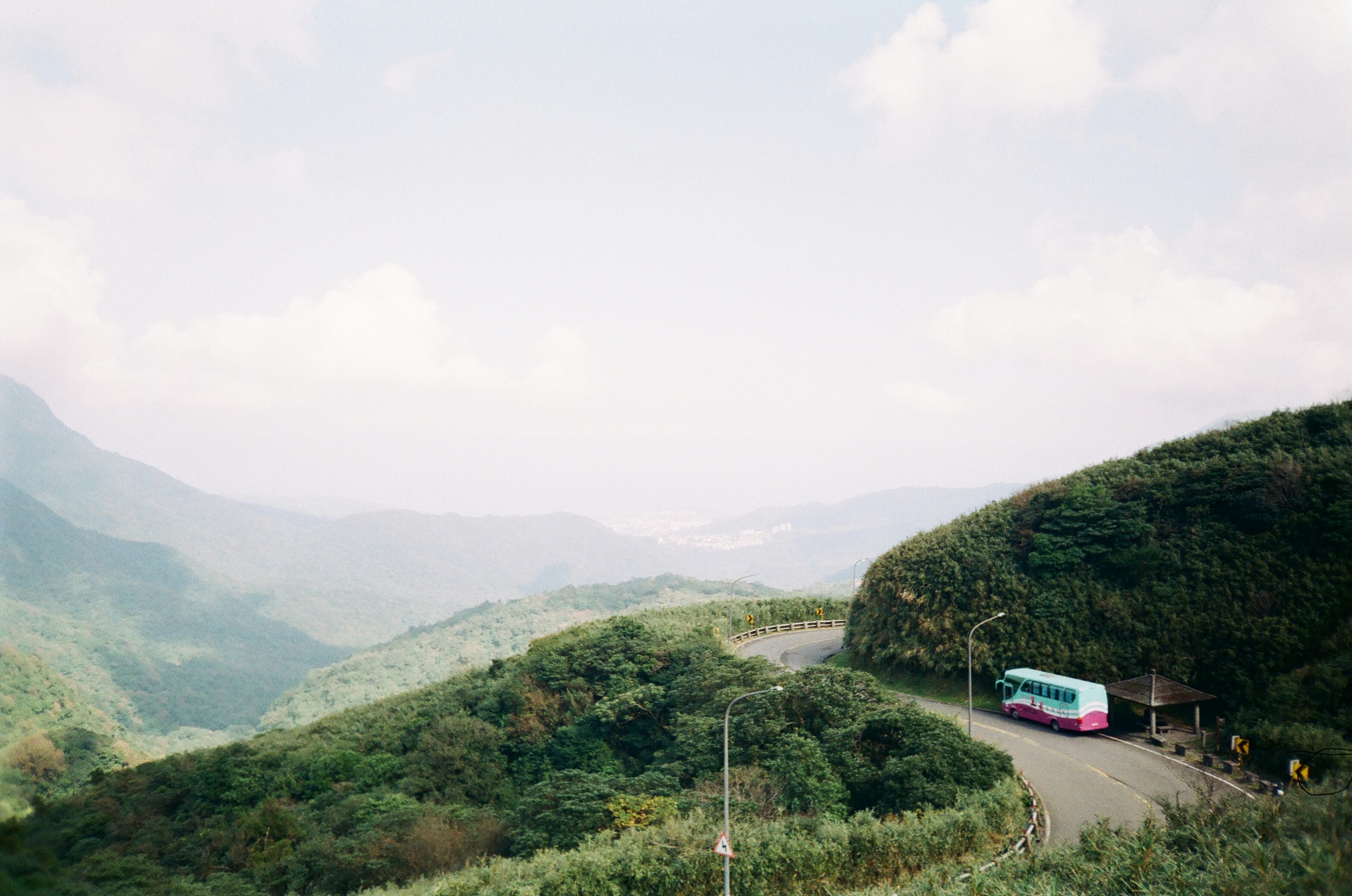 a bus driving down a road