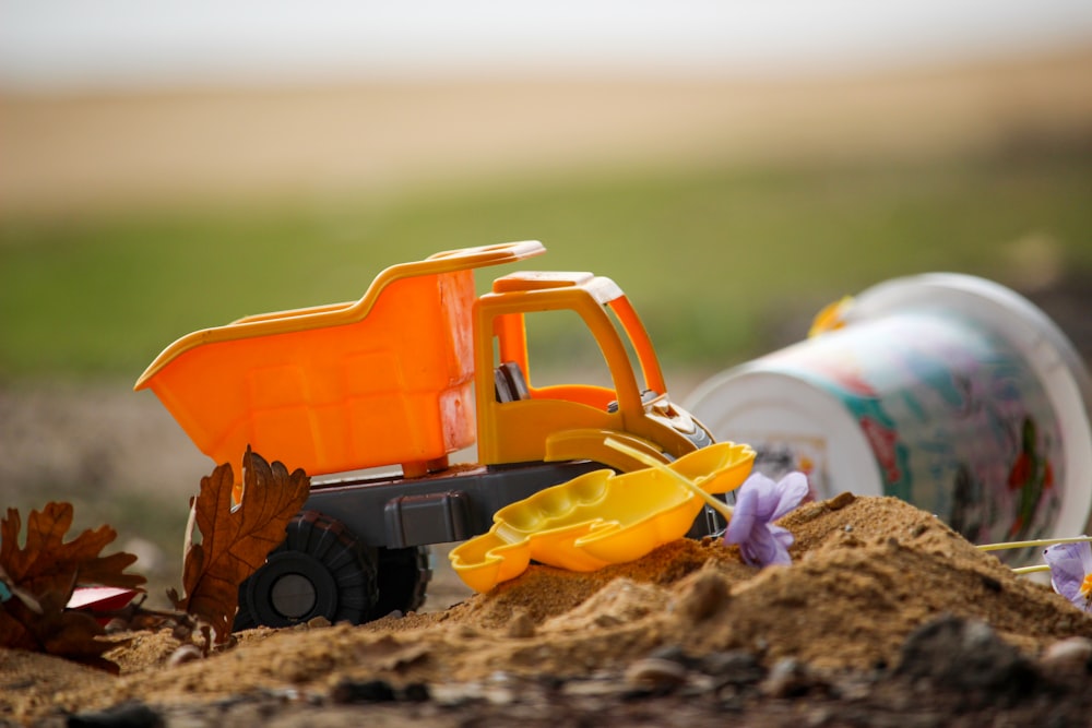 a toy truck on a rock