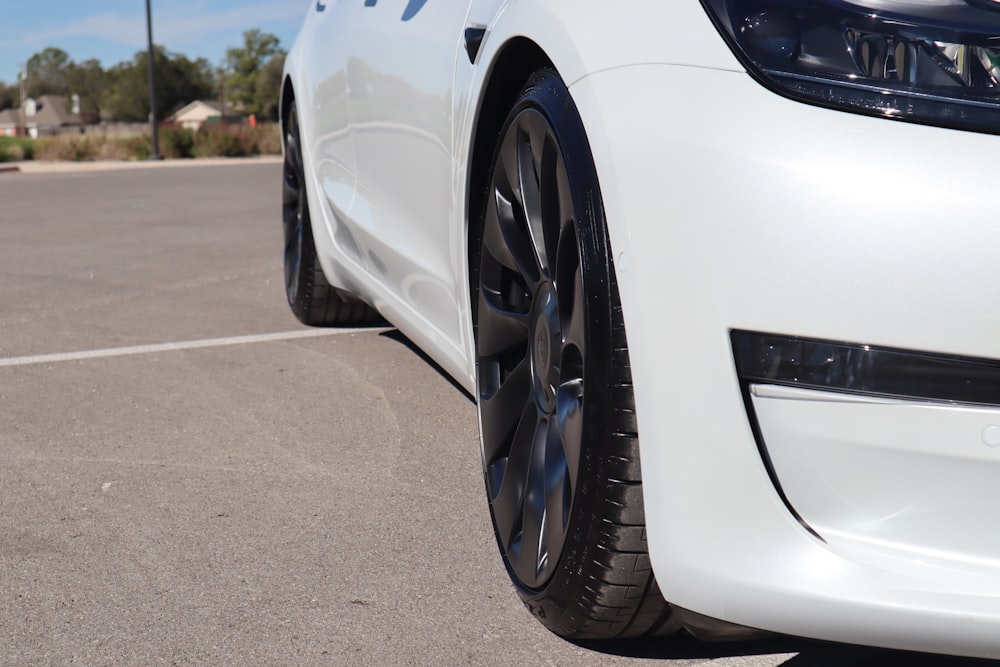 a white car with black rims