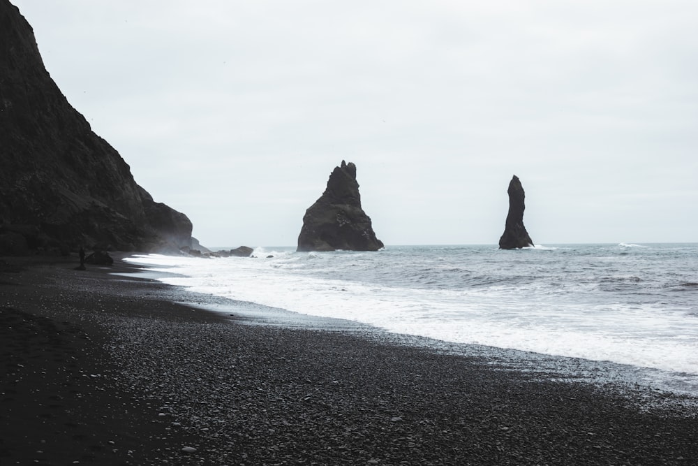 a beach with large rocks