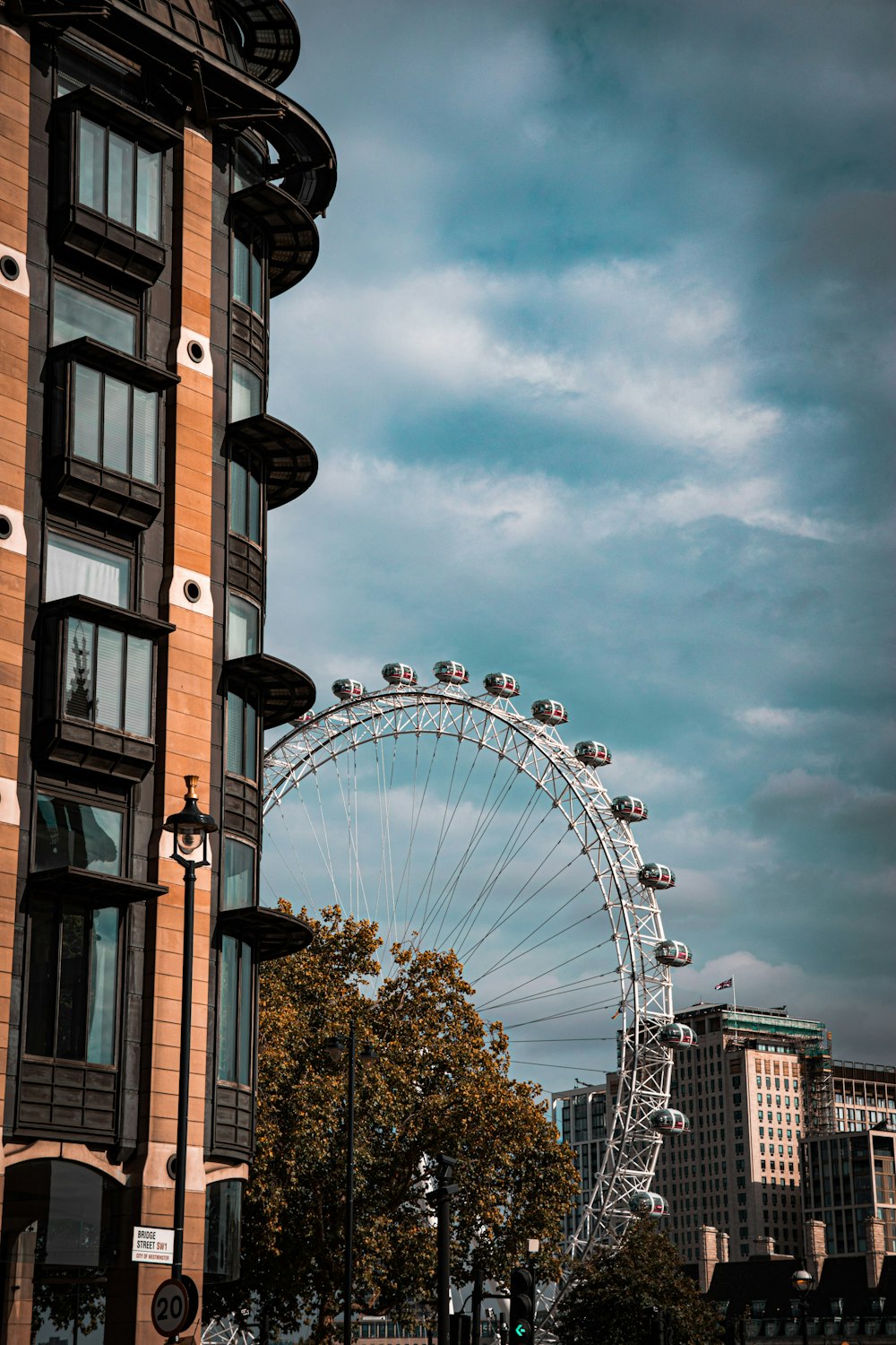 a ferris wheel next to a building