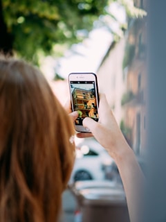 a woman holding a cell phone