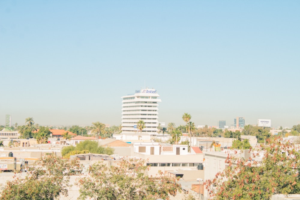 a large white building in a city