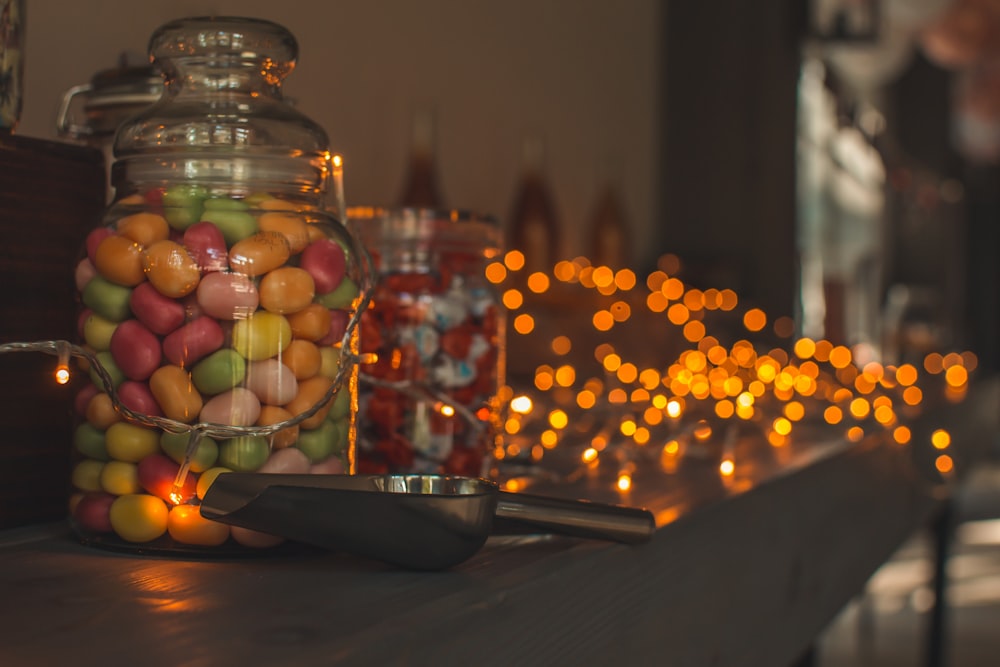 a table with a bottle of wine and grapes