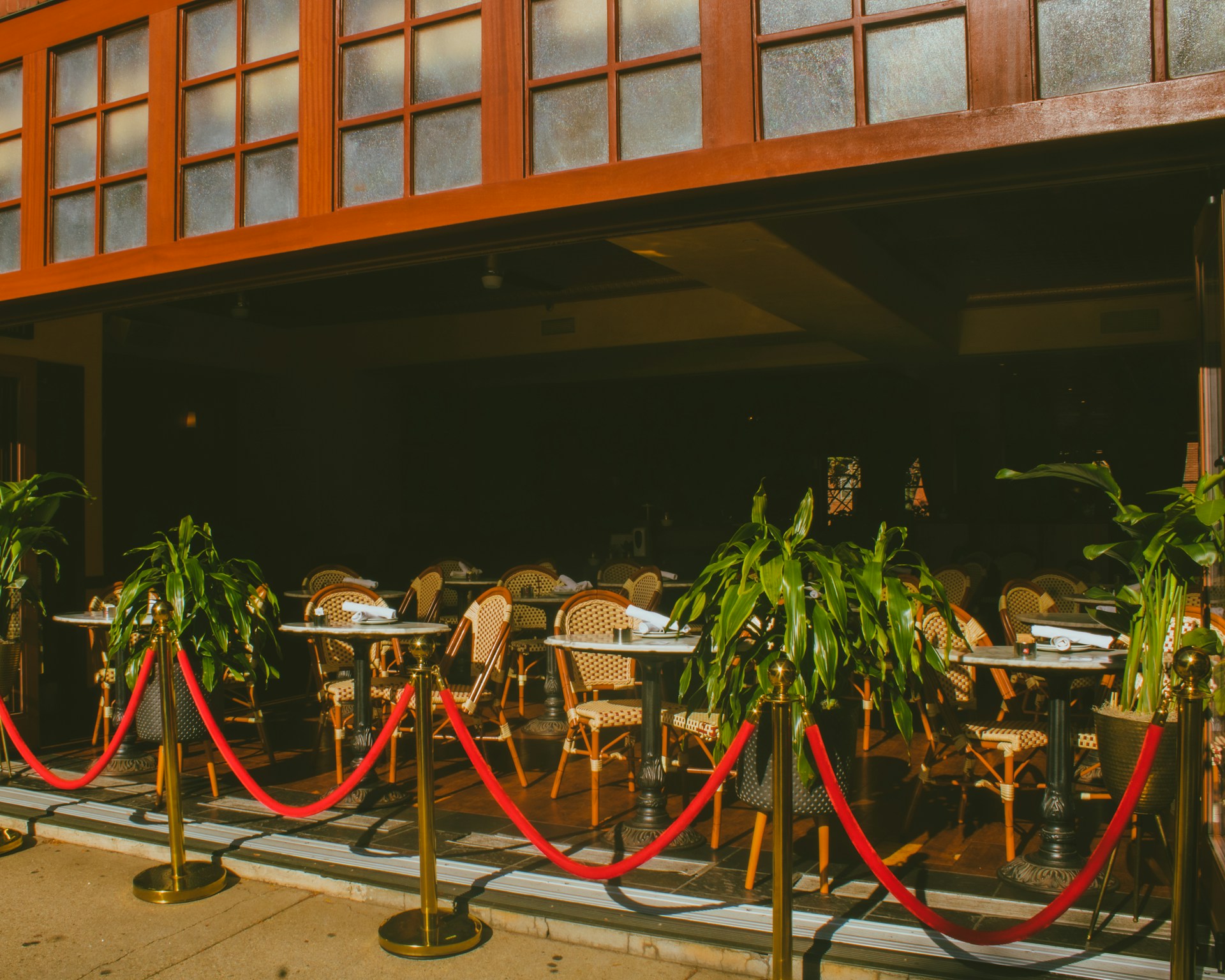 a group of chairs and tables outside a building