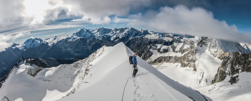 a man hiking up a snowy mountain