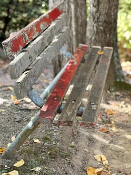 Faded teak bench showing signs of wear and discoloration.