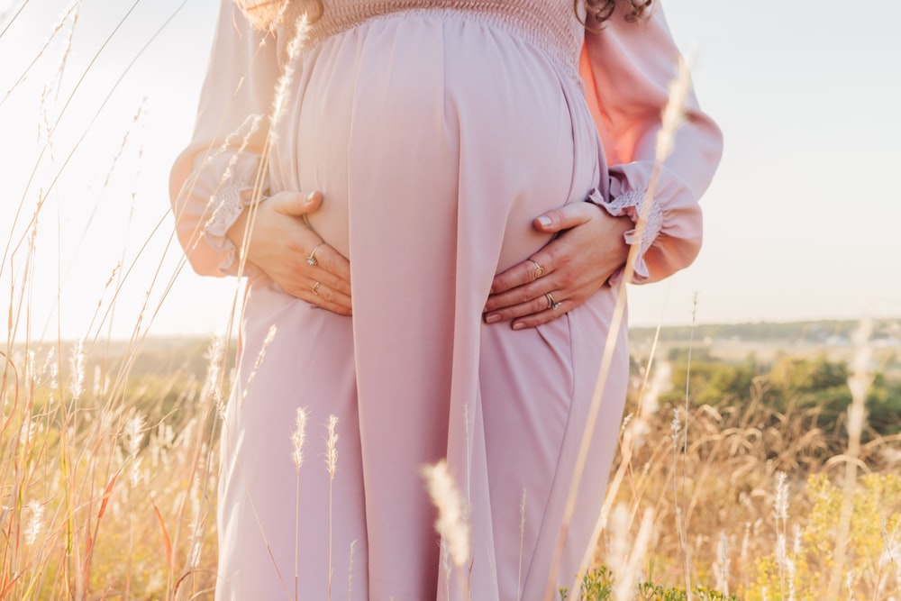 a person wearing a pink dress