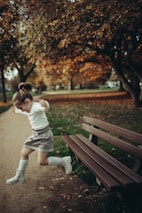 a little girl playing in a park