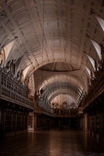 a large room with many arches and a ceiling with many arches