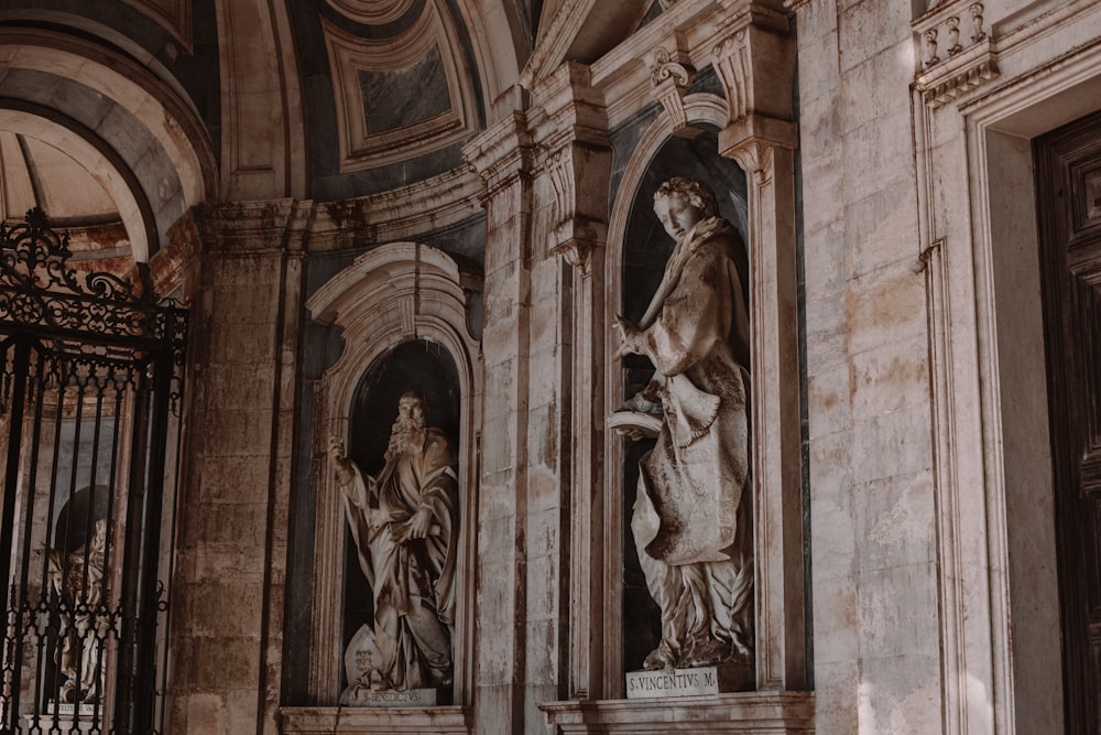 a statue of a woman and a man in a building