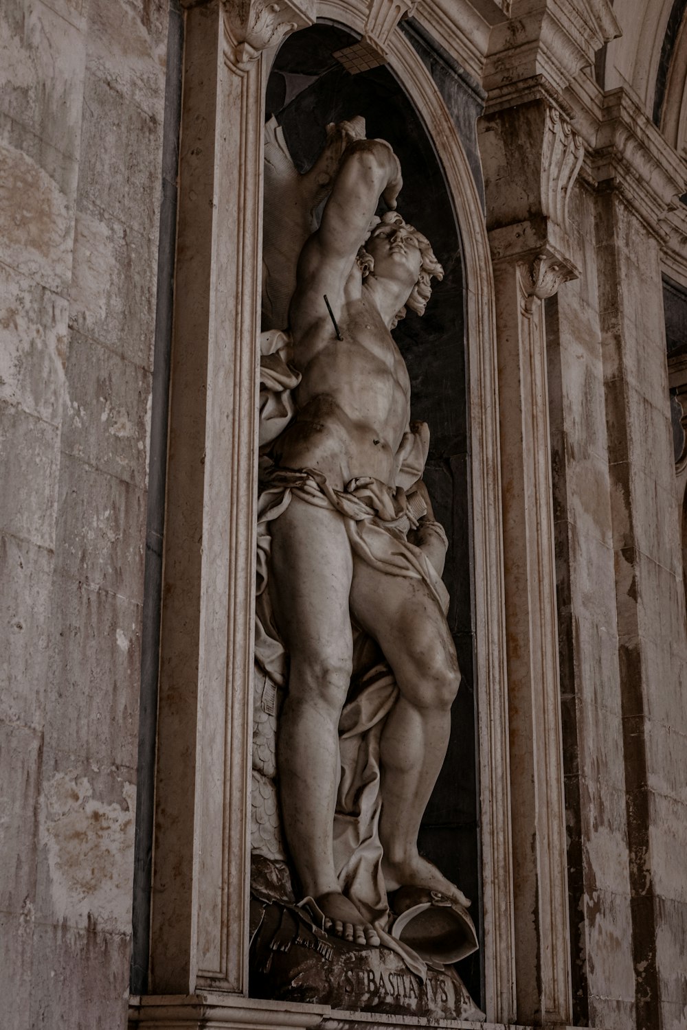 a statue of a man holding a baby