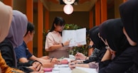 A mentor guiding a small group of eager learners.