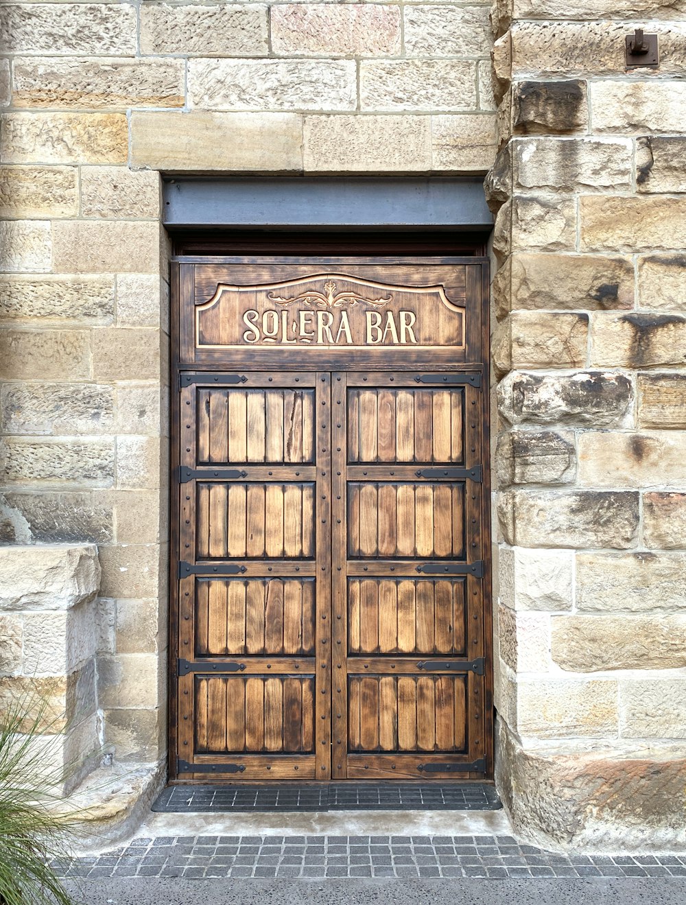 a wooden door on a stone building