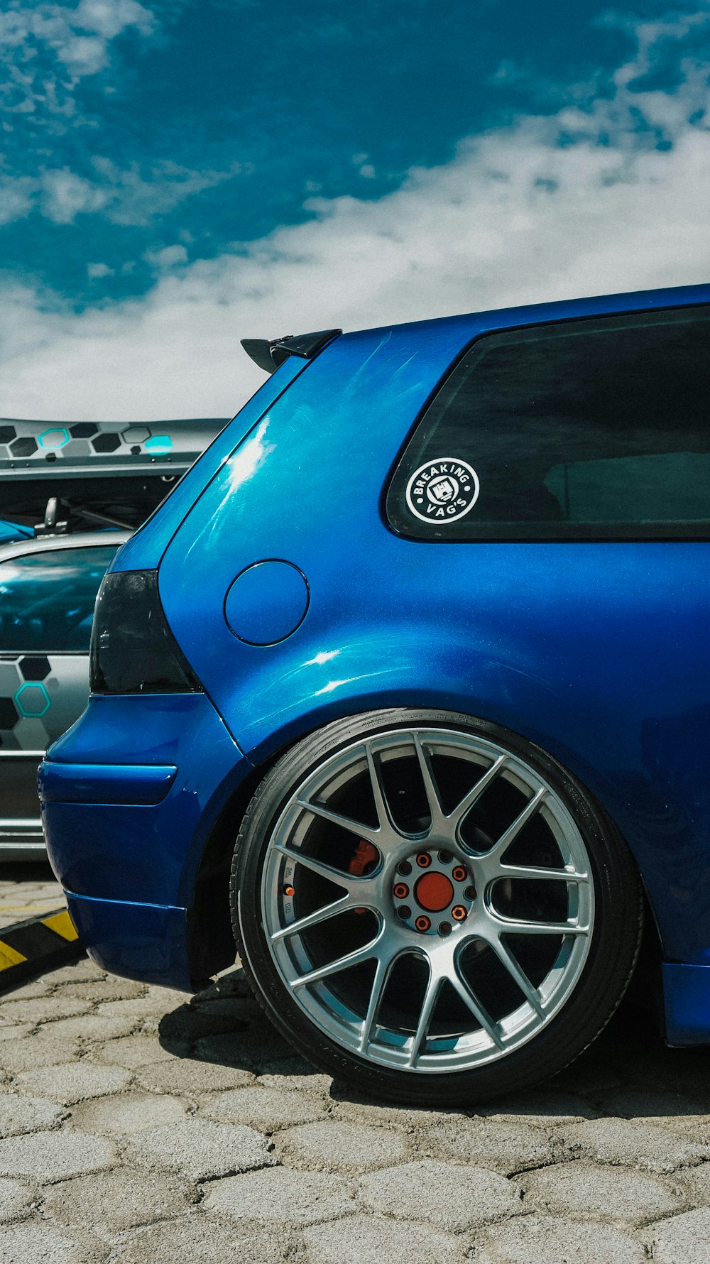 a blue car with a black rim