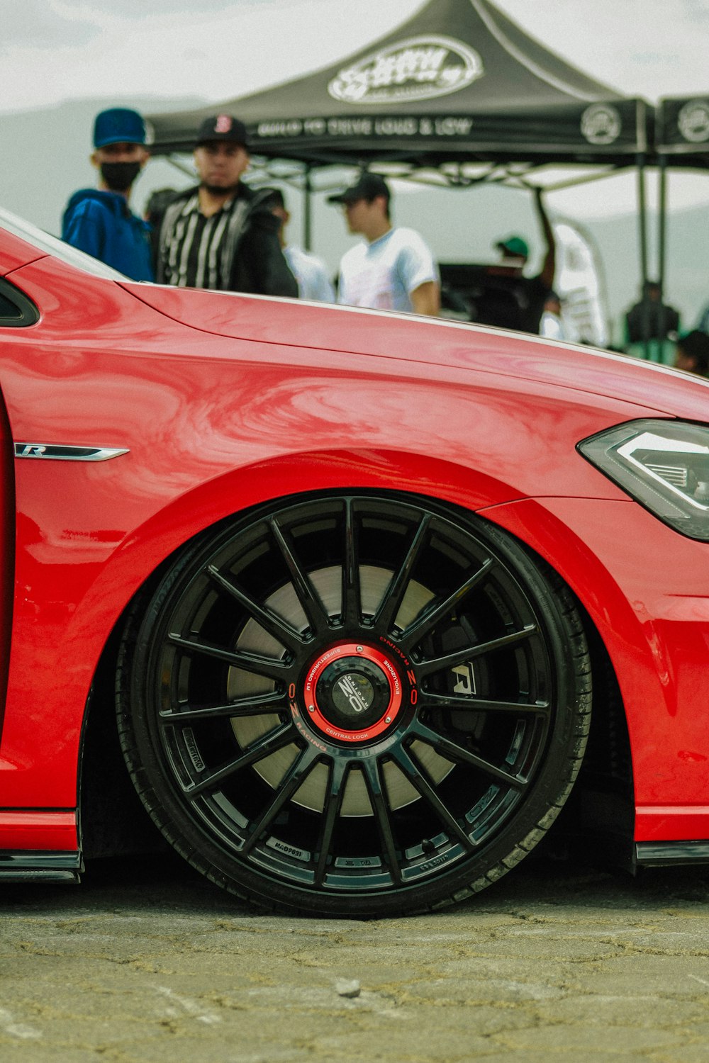 a red car with a black rim