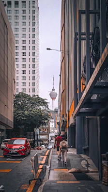 people walking on a sidewalk