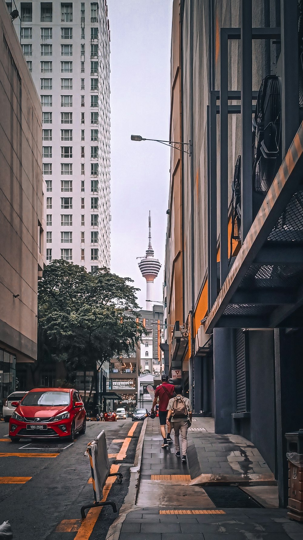 people walking on a sidewalk