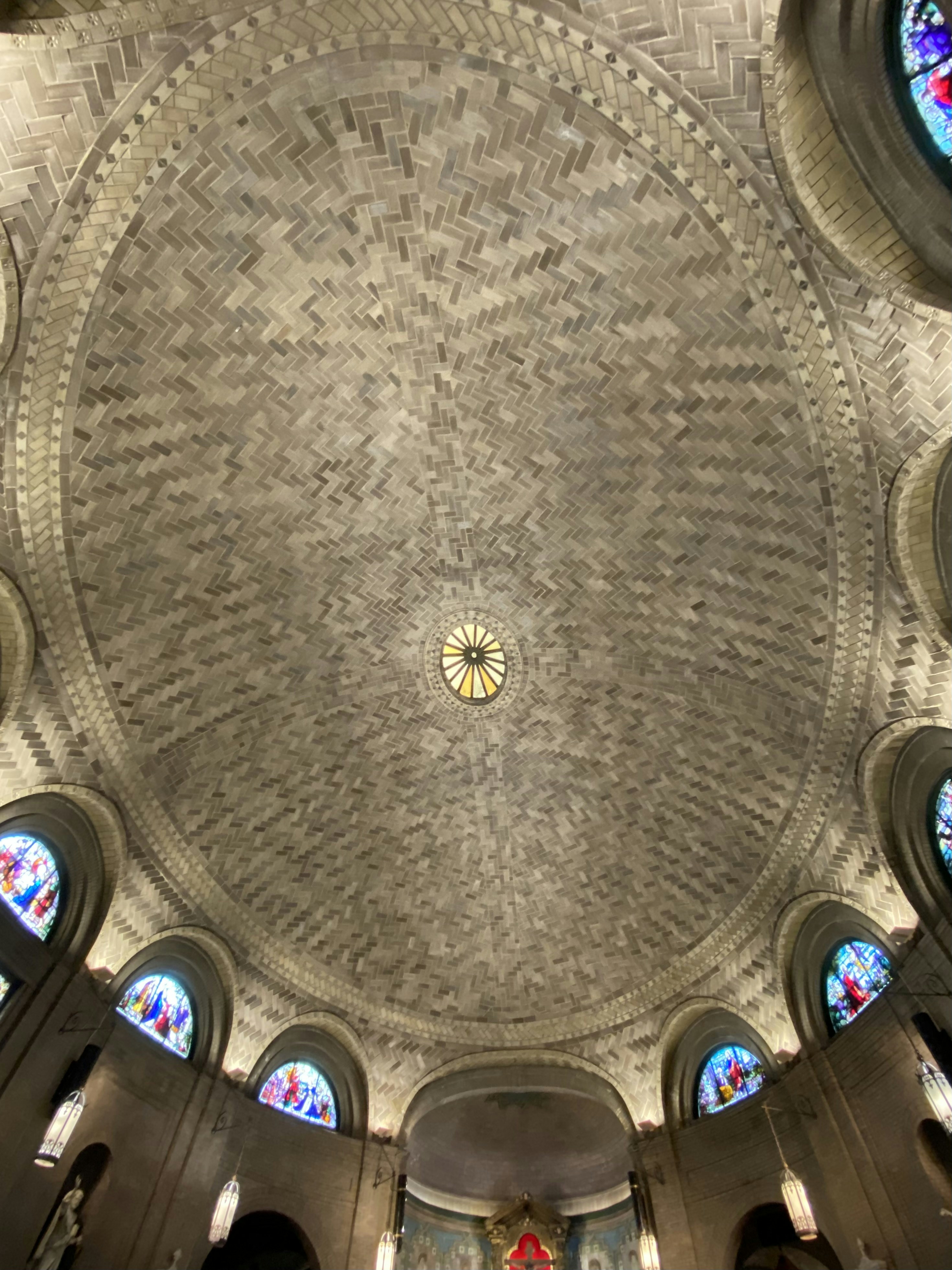 a large domed ceiling with stained glass windows