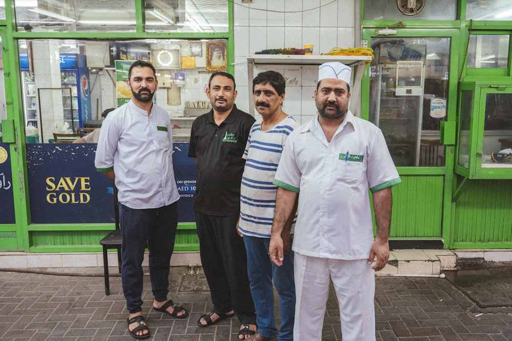 a group of men posing for a photo