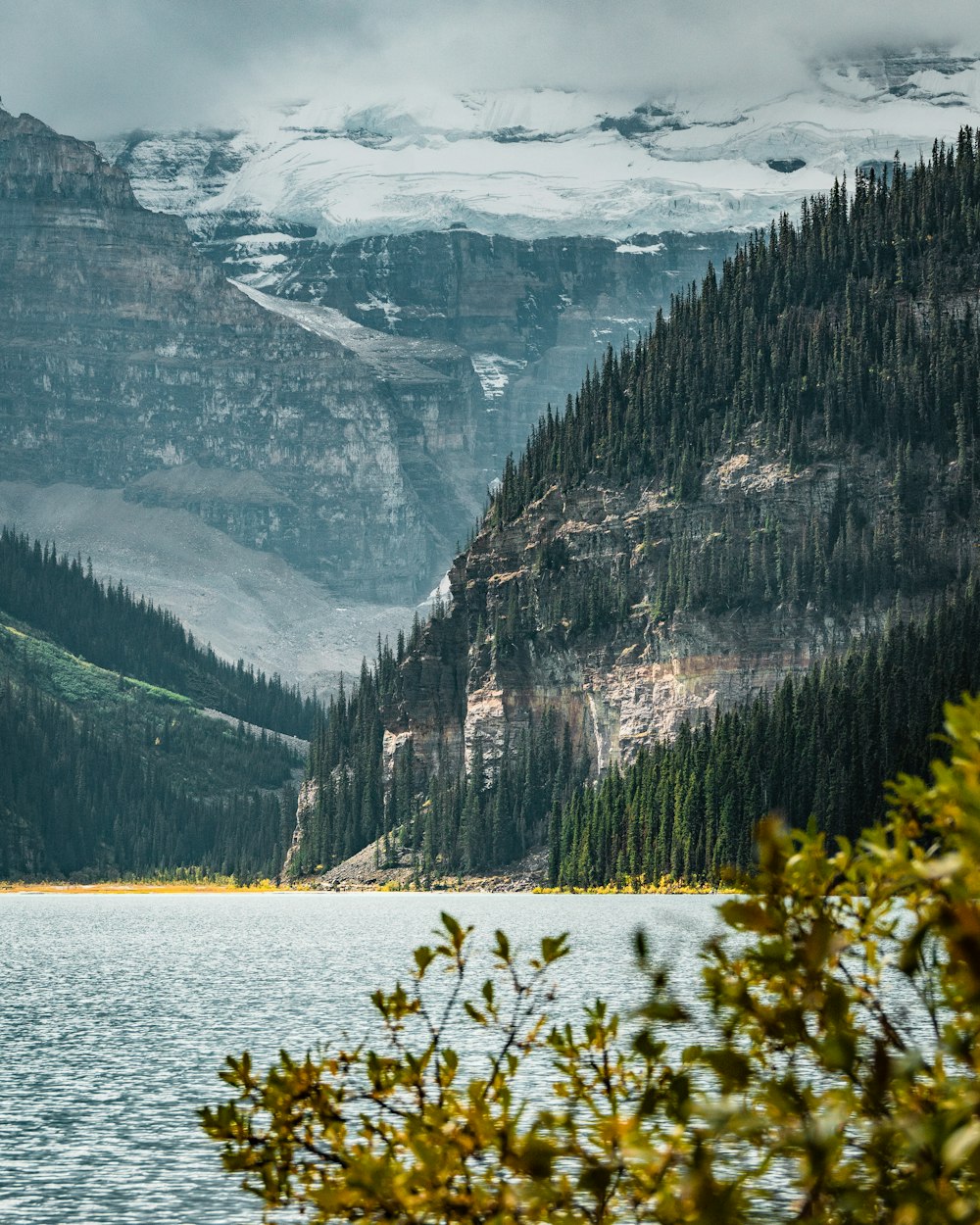 a lake with mountains in the background