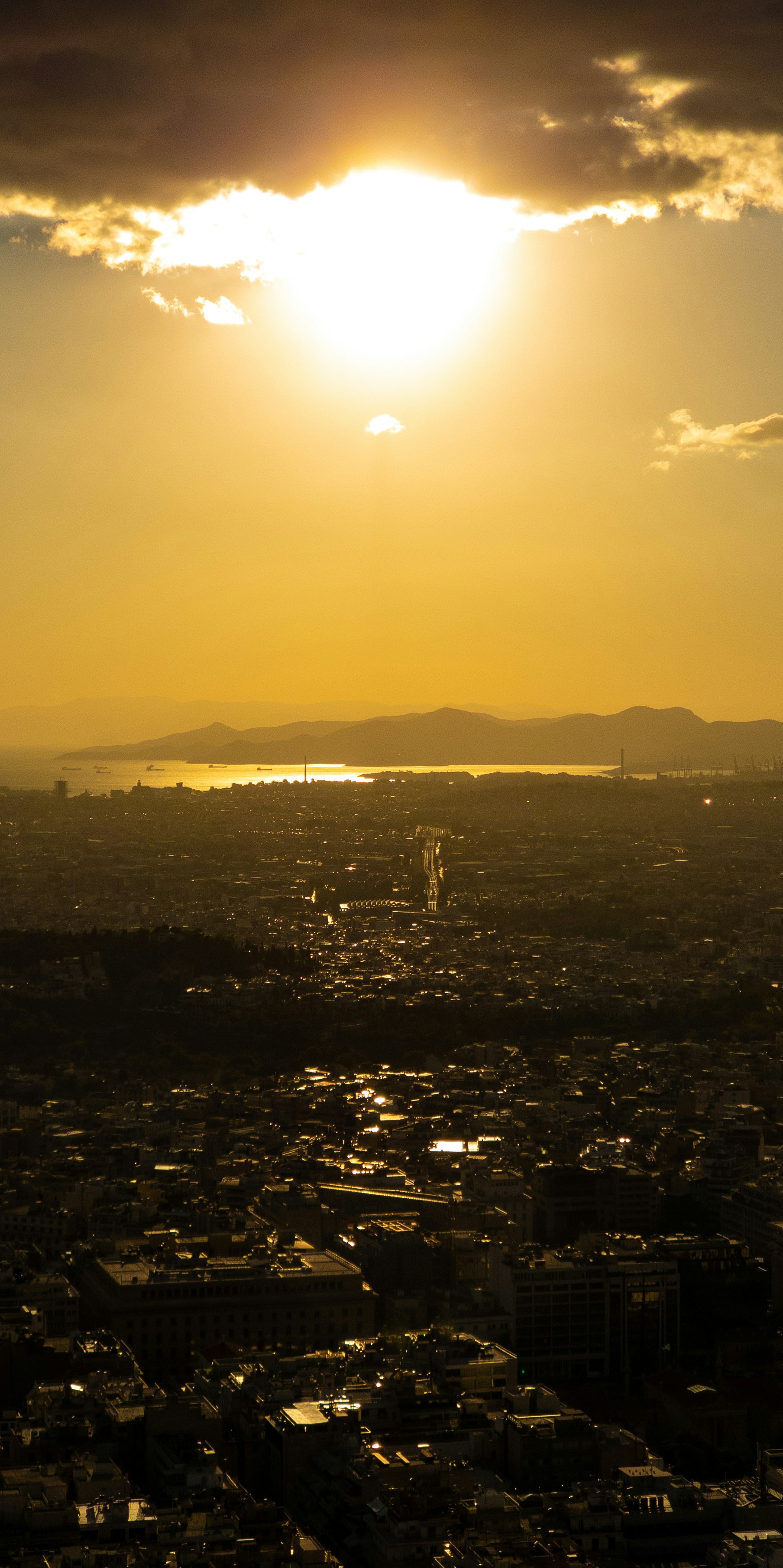 a city with a body of water in the background