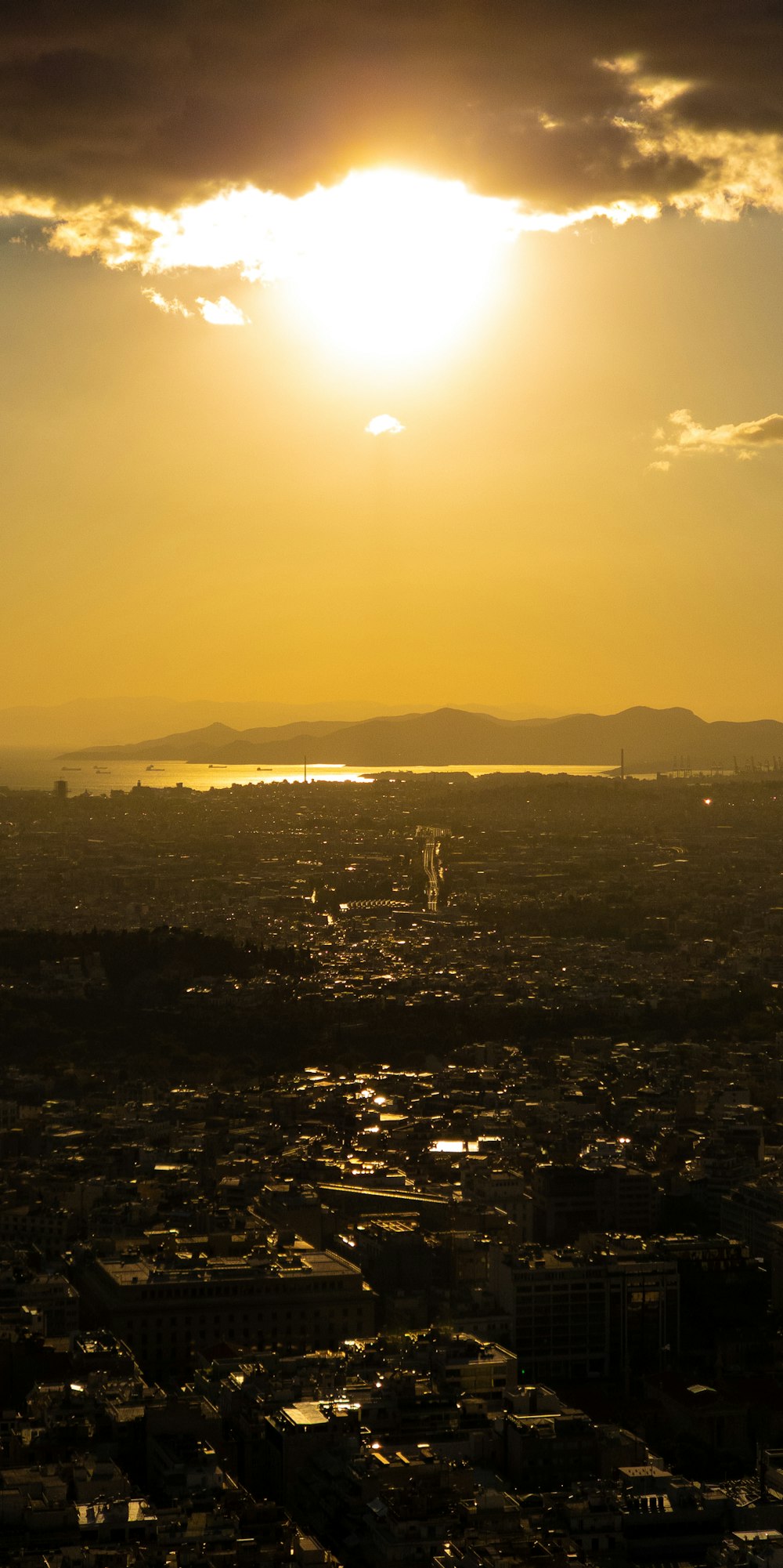 a city with a body of water in the background