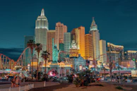 New York-New York Hotel and Casino with a statue and a body of water