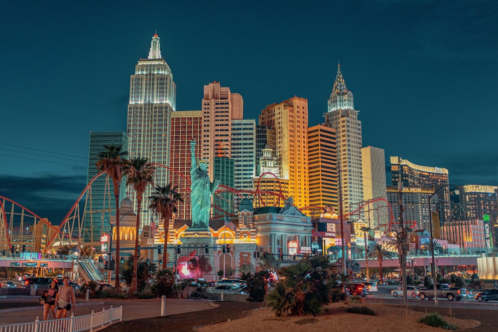 New York-New York Hotel and Casino with a statue and a body of water