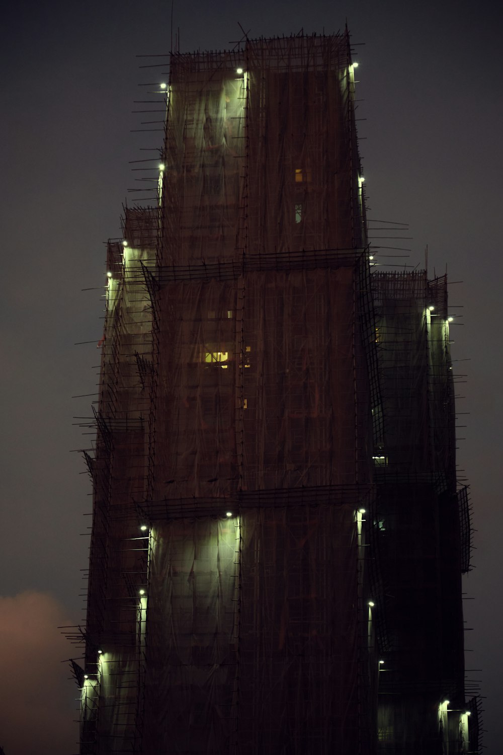 a tall building with lights on