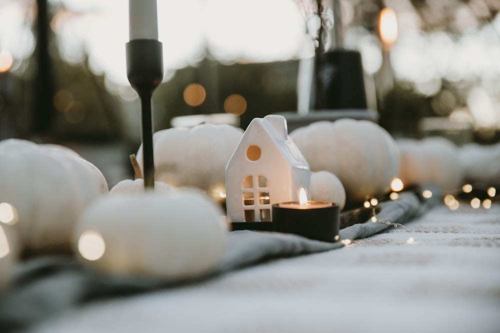 a small house on a pile of snow