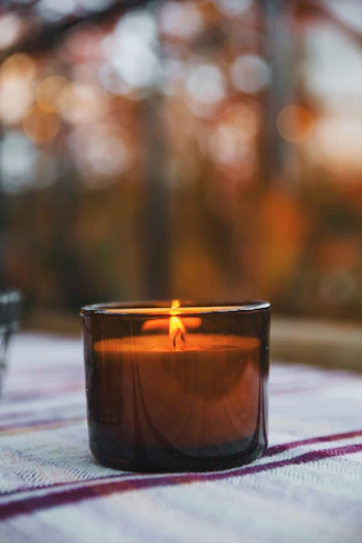 a candle in a glass